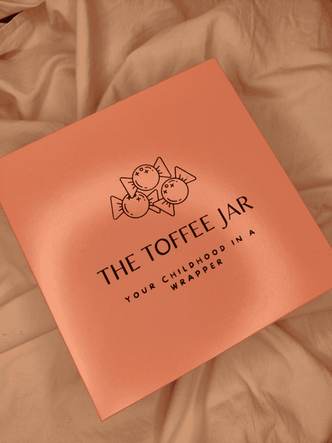 The Toffee Jar gift box on soft fabric
