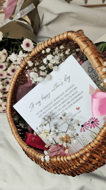 Personalized Mother's Day gift basket with card, flowers, and treats